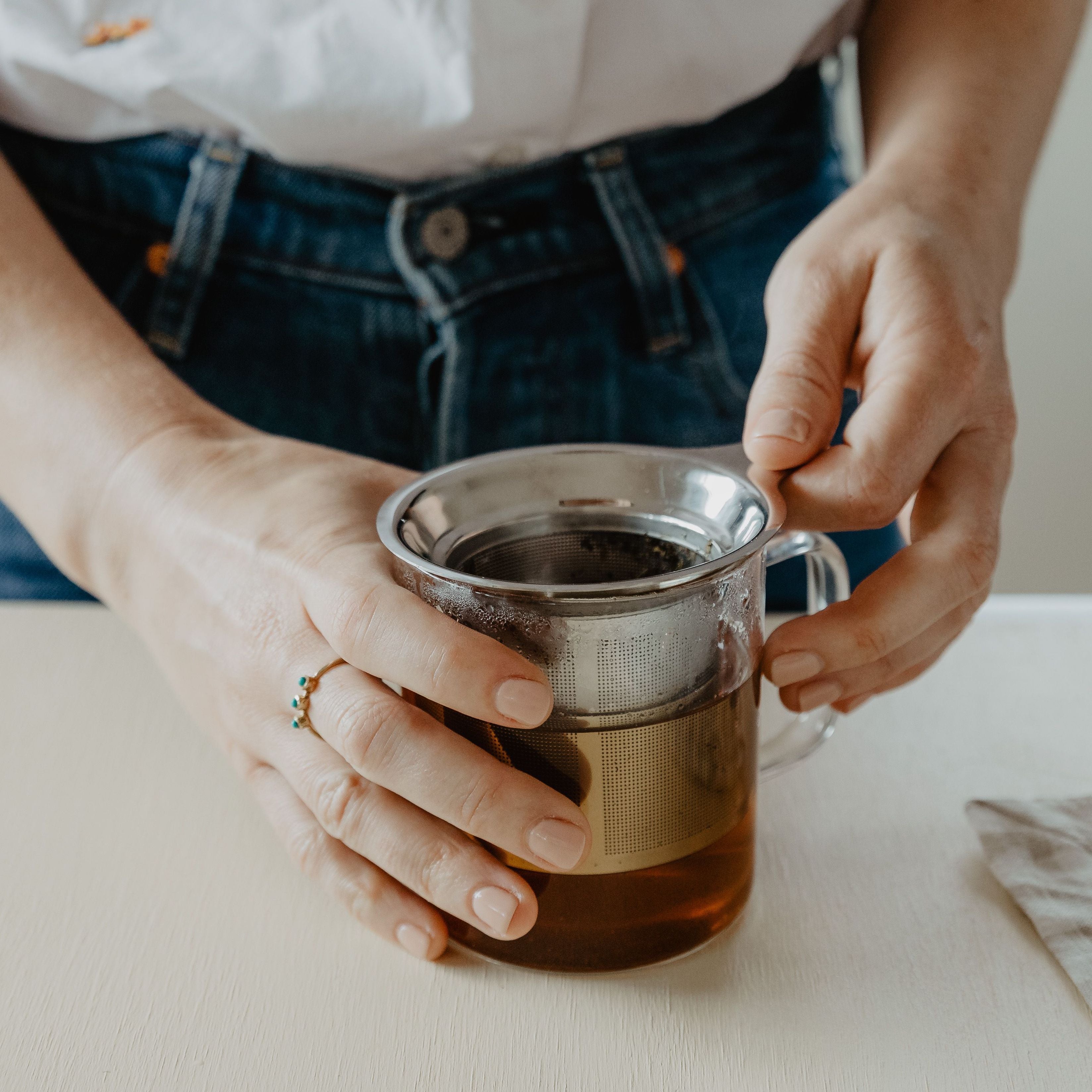 Infuser in a mug steeping tea.